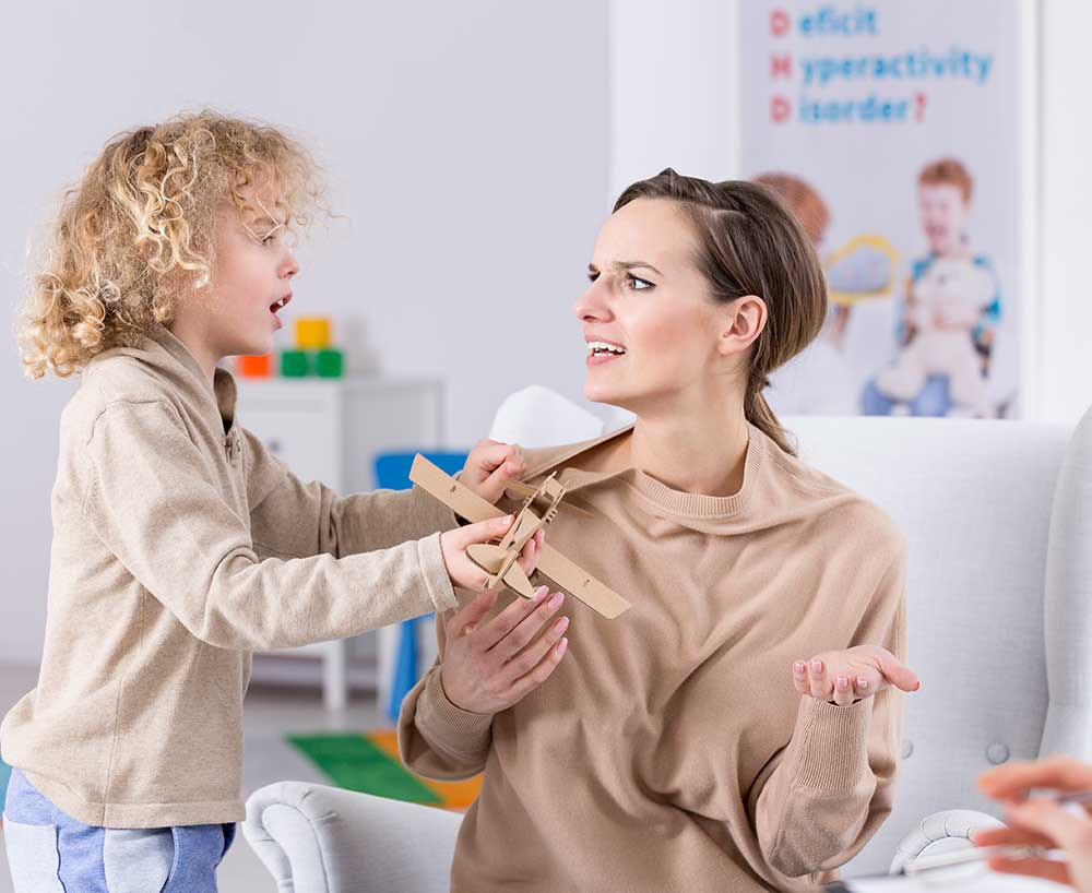 adhd-blurb-image-1000-x-818 child-with-adhd-putting-paper-air-plane-in-mothers-face-vanguard-psychiatry